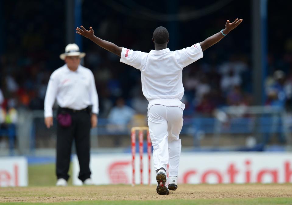 West Indies bowler Kemar Roach (R) appea