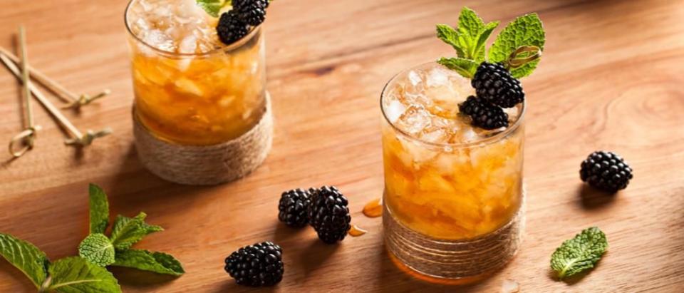 <p><strong>Ingredients </strong></p><p>2 oz Cruzan Estate Diamond Dark Rum<br>.5 oz turbinado syrup*<br>Pinch fresh mint leaves<br>3 blackberries<br>Ice, Crushed</p><p><strong>Instructions</strong></p><p>Muddle mint and berries in a julep cup. Add rum and turbinado syrup and fill with crushed ice. Take a bouquet of mint and rinse with water, then sprinkle mint with powdered sugar and garnish with 3 speared blackberries.</p><p><strong>*Turbinado Syrup</strong> — Combine 8 parts hot water and 8 parts turbinado sugar. Stir until sugar is dissolved. Refrigerate for up to 30 days.</p>