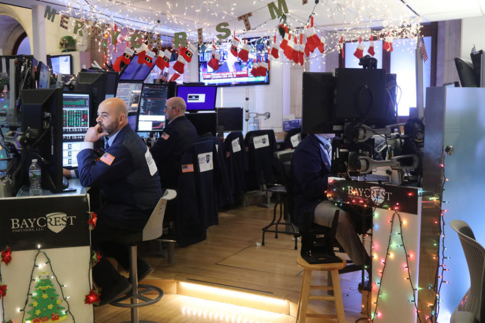 NEW YORK, NEW YORK - DECEMBER 23: Traders work on the floor of the New York Stock Exchange (NYSE) during the beginning of the Christmas holiday week on December 23, 2019 in New York City. Following news that China will cut import tariffs on a wide range of goods, stocks climbed over 100 points in morning trading Monday.  (Photo by Spencer Platt/Getty Images)