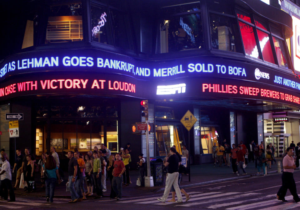 The Lehman Brothers name moves across a news ticker in New York's Times Square on Sept. 15, 2008.