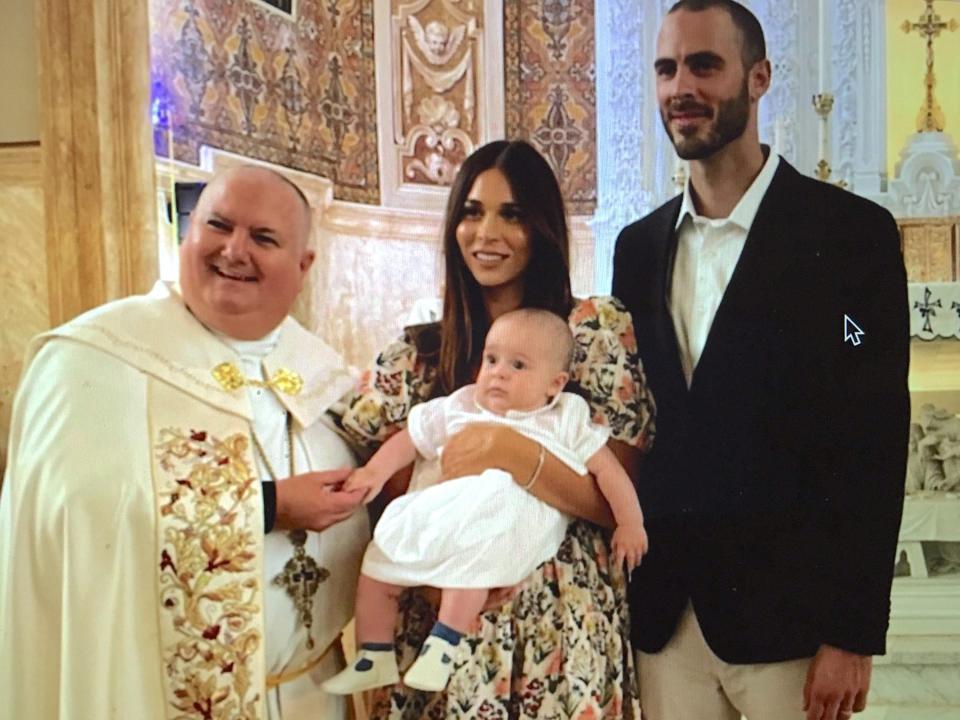 Father Glenn with baby Oscar Anthony Campolo and parents Ali Tamposi Campolo and Roman Campolo