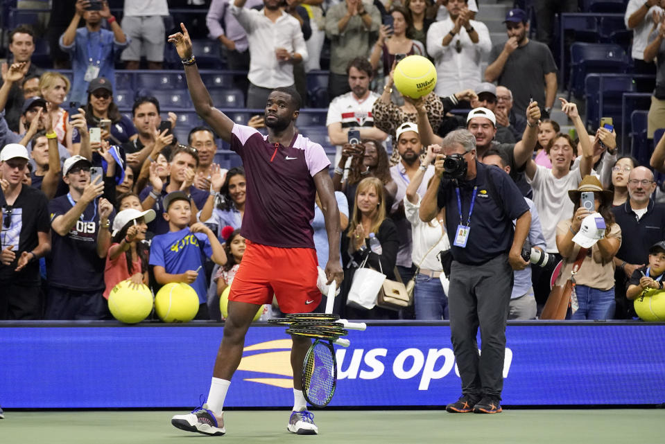Frances Tiafoe, of the United States, acknowledges the crowd after losing to Carlos Alcaraz, of Spain, during the semifinals of the U.S. Open tennis championships, Friday, Sept. 9, 2022, in New York. (AP Photo/Charles Krupa)