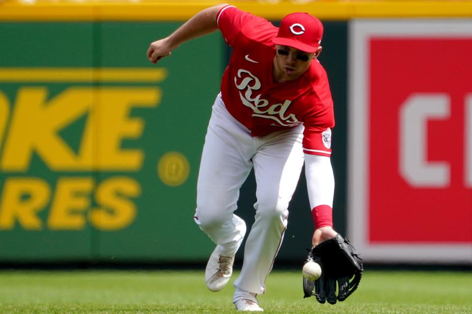 Cincinnati Reds second baseman Brandon Drury (22) fields a groundball in the eighth inning of a baseball game against the Milwaukee Brewers, Wednesday, May 11, 2022, at Great American Ball Park in Cincinnati. The Cincinnati Reds won, 14-11.