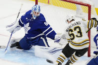 Toronto Maple Leafs goaltender Joseph Woll (60) stops Boston Bruins' Brad Marchand (63) during the first period in Game 6 of an NHL hockey Stanley Cup first-round playoff series in Toronto on Thursday, May 2, 2024. (Frank Gunn/The Canadian Press via AP)