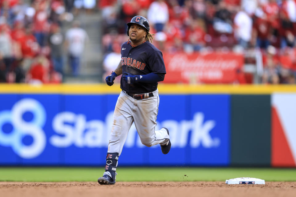 Cleveland Guardians' Jose Ramirez runs the bases after hitting a grand slam during the ninth inning of the team's baseball game against the Cincinnati Reds in Cincinnati, Tuesday, April 12, 2022. The Guardians won 10-5. (AP Photo/Aaron Doster)