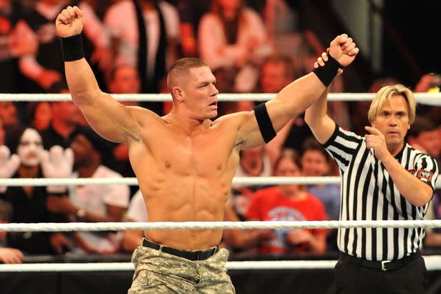 <p>Moses Robinson/Getty</p> John Cena on Oct. 31, 2011