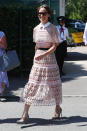 <p>Turning heads at Wimbledon, Pippa wore a blush pink, semi-sheer lace number from Self-Portrait featuring cape sleeves and a contrasting white collar.<br><em>[Photo: Getty]</em> </p>