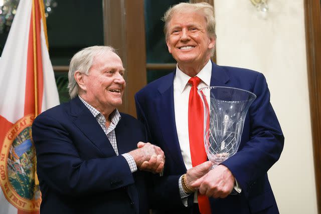 <p>Joe Raedle/Getty</p> Retired golfer Jack Nicklaus presents Donald Trump with an award on behalf of Trump International Golf Club on March 24, 2024