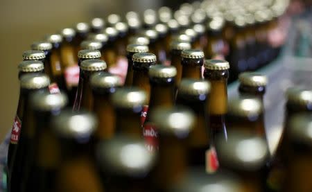 Bottles of beer are transported on a belt at 'Kloster Andechs' brewery in Andechs near Munich, Germany, April 19, 2016. REUTERS/Michaela Rehle