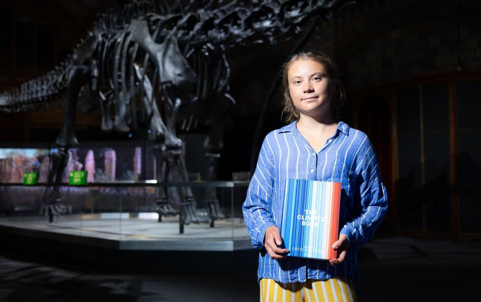 Teenage climate activist Greta Thunberg with her new book, The Climate Book - Tim Whitby/Getty Images Europe