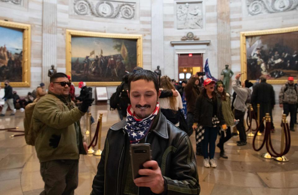 Supporters of US President Donald Trump protest in the US Capitol Rotunda on January 6, 2021, in Washington, DC. - Demonstrators breeched security and entered the Capitol as Congress debated the a 2020 presidential election Electoral Vote Certification. (Photo by SAUL LOEB / AFP)