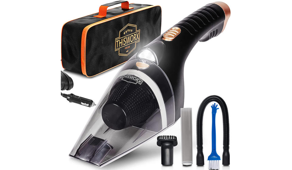 A small handheld vacuum cleaner along with accessories and a bag.