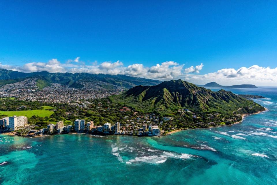Diamond Head volcanic crater towering over the suburbs of Honolulu (Getty Images)