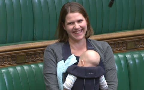 Jo Swinson with her baby Gabriel in her Commons seat last year  - Credit: PA