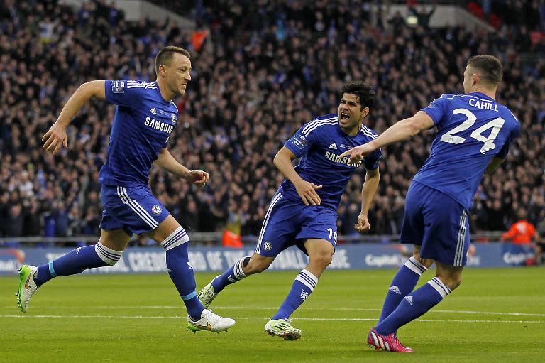 Chelsea's John Terry (L) celebrates scoring the opening goal with teammates Diego Costa (C) and Gary Cahill during their English League Cup final match against Tottenham Hotspur, at Wembley Stadium in London, on March 1, 2015