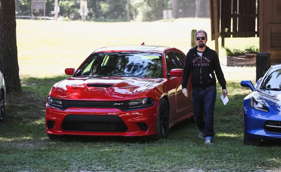 <p>Davey steps out of a Dodge Charger Hellcat during an annual pilgrimage to 10Best.</p>