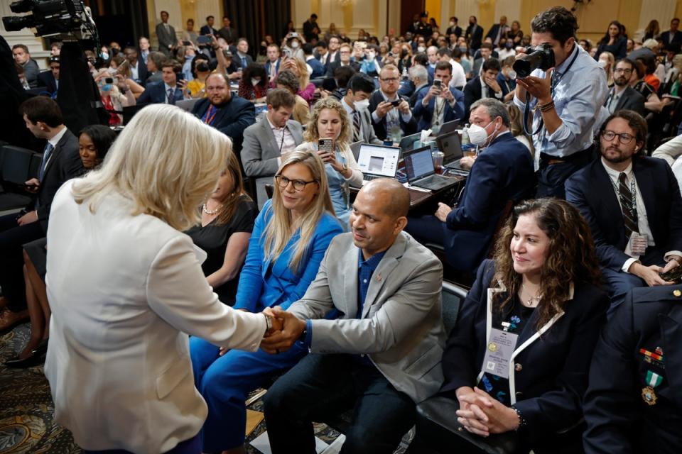 Rep. Liz Cheney (R-WY), Vice Chairwoman of the House Select Committee to Investigate the January 6th Attack on the U.S. Capitol, shakes hands with former U.S. Capitol Police Officer Aquilino Gonell (Getty Images)