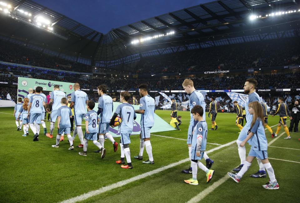 <p>Britain Football Soccer – Manchester City v Arsenal – Premier League – Etihad Stadium – 18/12/16 Manchester City players wear shirts in support of injured team mate Ilkay Gundogan before the match Action Images via Reuters / Carl Recine Livepic EDITORIAL USE ONLY. No use with unauthorized audio, video, data, fixture lists, club/league logos or “live” services. Online in-match use limited to 45 images, no video emulation. No use in betting, games or single club/league/player publications. Please contact your account representative for further details. </p>
