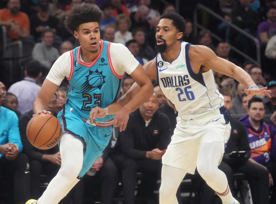 Jan 26, 2023; Phoenix, Arizona, USA; Phoenix Suns forward 	Cameron Johnson (23) drives past Dallas Mavericks guard Spencer Dinwiddie (26) at Footprint Center. Mandatory Credit: Joe Rondone-Arizona Republic