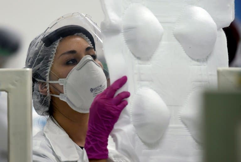 Dans une usine de masques au Mexique, en mai 2020 - ALFREDO ESTRELLA                     © 2019 AFP