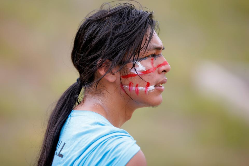 Naki Karaga cheers on his teammates in a fast-paced stickball game during a celebration of Indigenous Peoples Day on Monday, Oct. 10, 2022, at the First Americans Museum.