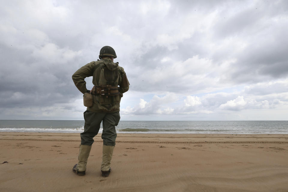 French enthusiast Julien watches the English channnel from Omaha beach, Normandy, Wednesday June 5, 2019. Extensive commemorations are being held in the U.K. and France to honor the nearly 160,000 troops from Britain, the United States, Canada and other nations who landed in Normandy on June 6, 1944 in history's biggest amphibious invasion. (AP Photo/David Vincent)