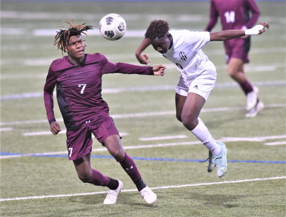 Abilene High's David Masha, right, heads the ball away from El Paso Andress' Isaiah Owens. bilene High won the Region I-5A area playoff game 1-0 on Monday, March 27, 2023, at Astound Broadband Stadium in Midland.