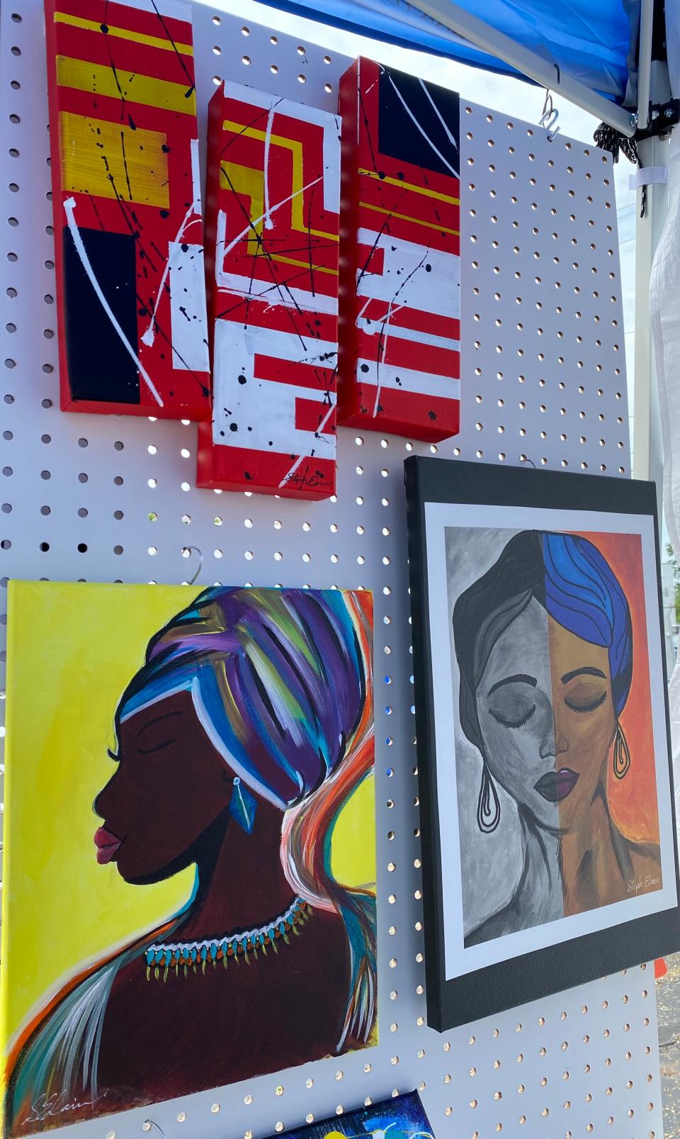 Artwork is displayed at a booth at last summer's African American Arts Festival in Canton. This year's event is 10 a.m. to 10 p.m. Friday and Saturday at Centennial Plaza in downtown Canton.