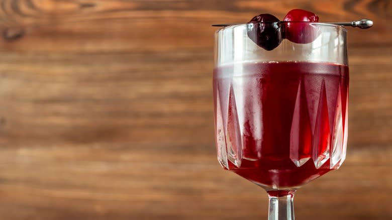 Glass garnished with two cherries