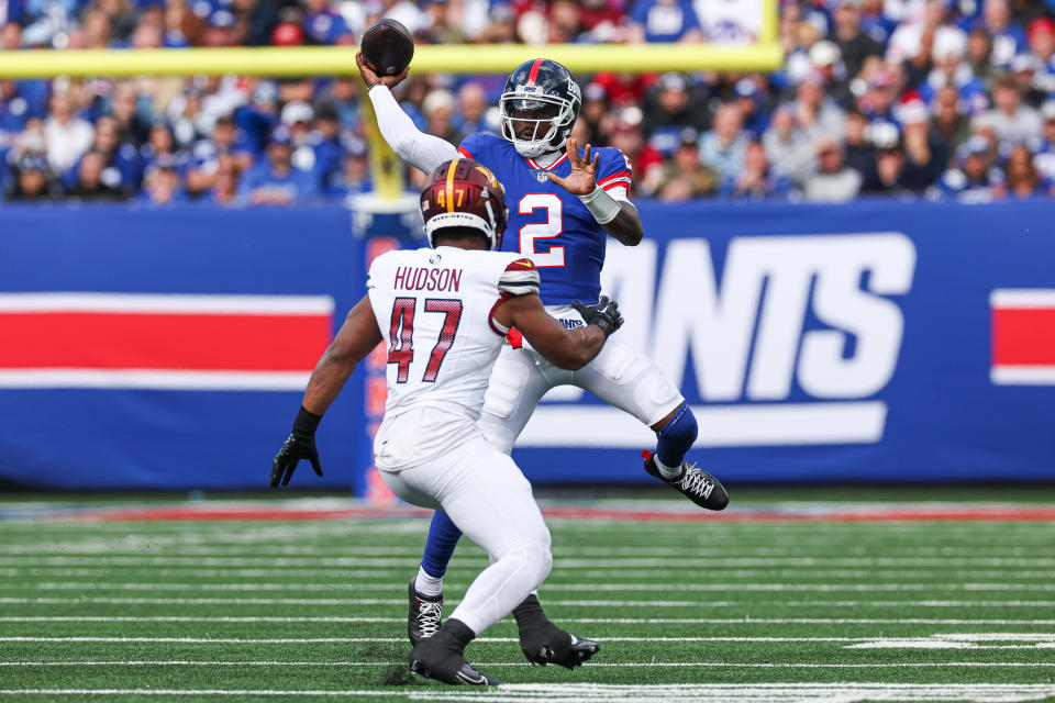 New York Giants quarterback Tyrod Taylor (2) throws the ball as Washington Commanders linebacker <a class="link " href="https://sports.yahoo.com/nfl/players/32832" data-i13n="sec:content-canvas;subsec:anchor_text;elm:context_link" data-ylk="slk:Khaleke Hudson;sec:content-canvas;subsec:anchor_text;elm:context_link;itc:0">Khaleke Hudson</a> (47). Mandatory Credit: Vincent Carchietta-USA TODAY Sports