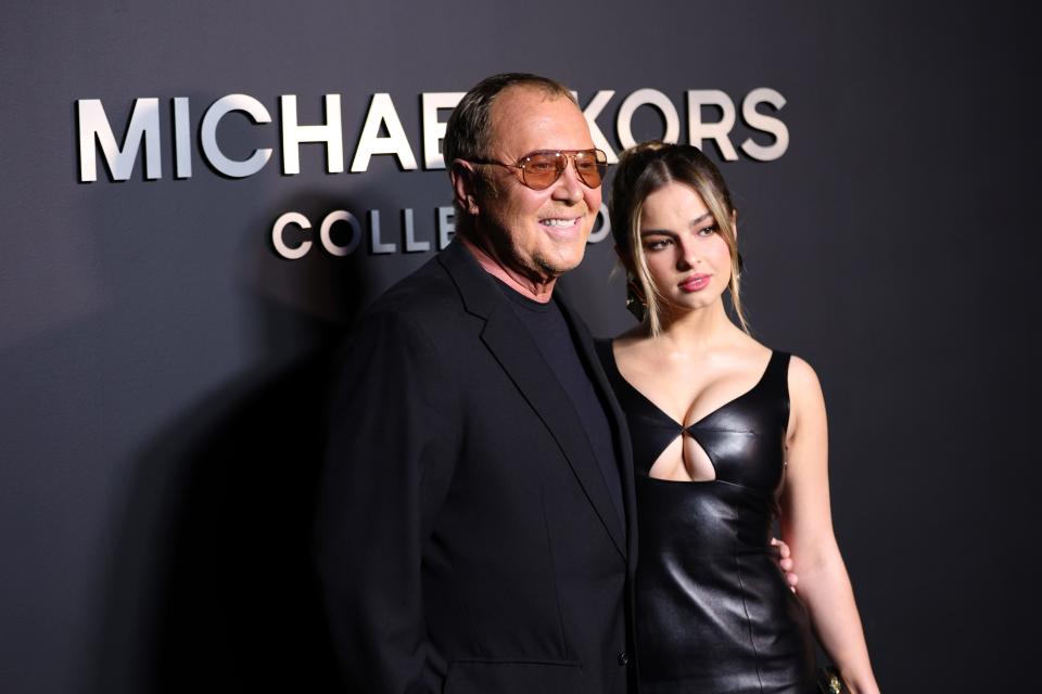 Addison Rae (right) poses with Michael Kors at the designer's recent fashion show in New York. The social media influencer used her success on TikTok to catapult her to mainstream success, as evidenced by Rae's multi-million dollar deal with Netflix.