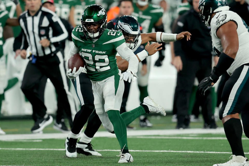 Oct 15, 2023; East Rutherford, New Jersey, USA; New York Jets safety Tony Adams (22) runs back an interception against Philadelphia Eagles quarterback Jalen Hurts (1) during the fourth quarter at MetLife Stadium. Mandatory Credit: Brad Penner-USA TODAY Sports