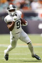 Michigan State running back Kenneth Walker III (9) runs with the ball during the second quarter of an NCAA college football game against Miami, Saturday, Sept. 18, 2021, in Miami Gardens, Fla. (AP Photo/Michael Reaves)