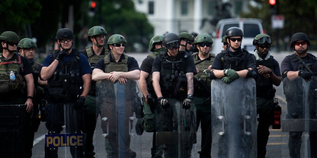 Members of the Federal Bureau of Prisons and other law enforcement block 16th Street, NW near the White House as protests over the death of George Floyd continue June 3, 2020, in Washington, DC