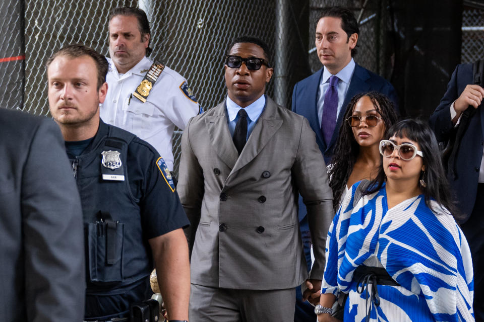 Jonathan Majors, and his girlfriend, Meagan Good, flanked by his lawyer Priya Chaudhry (R)