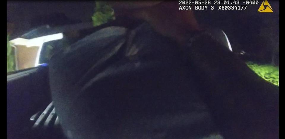 In this image from body-worn camera video, Lincoln County sheriff’s Sgt. Aldon Sutton grabs a handcuffed Barry Spencer Green by the throat during a May 28 arrest in Lincolnton.