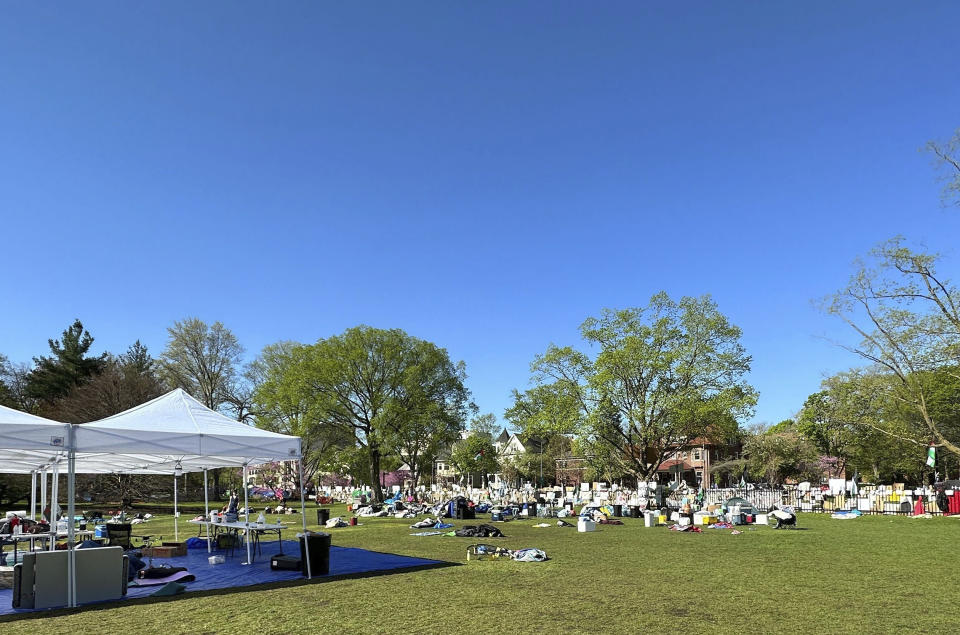 Tents, flags and other supplies remain at Deering Meadow on Northwestern University's campus in Evanston, Ill. on Tuesday, April 30, 2024, a day after the university and protest organizers announced an agreement which largely ended anti-war demonstrations that have lasted days. (AP Photo/Melissa Perez Winder)