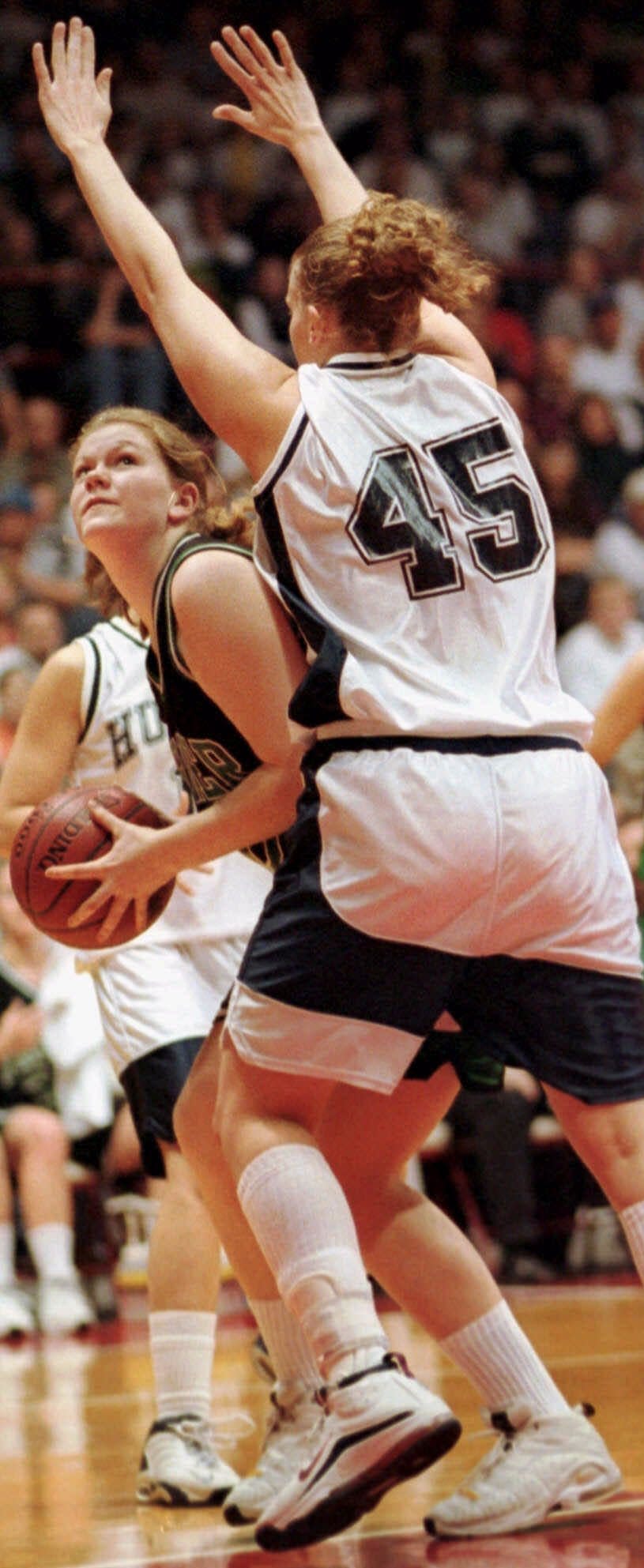 Janesville Parker's Korby Lathrop prepares to shoot against Hudson's Katie Germs (45) during the second half of the Division 1 championship game at the WIAA state tournament in Madison on Saturday, March 11, 2000. Lathrop made the game-winning free throw in Parker's 57-56 victory