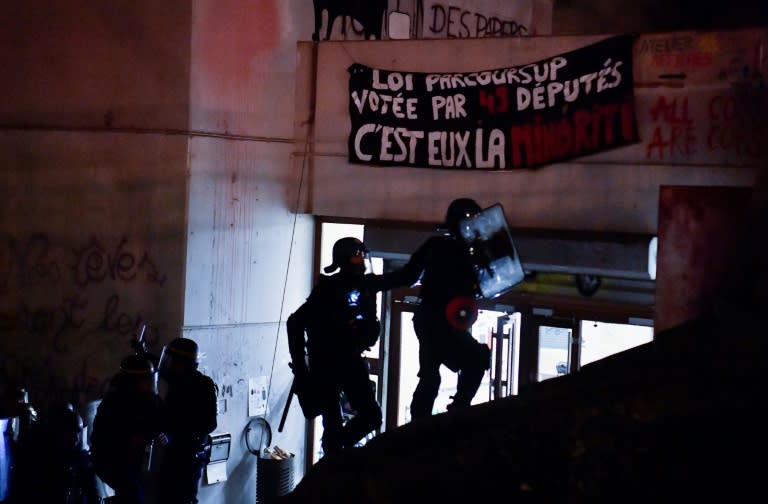 Around 100 French police stormed a campus building in Paris on Friday, ending a three-week sit-in by students