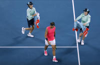 Spain's Rafael Nadal walks from the court during his quarterfinal against Austria's Dominic Thiem at the Australian Open tennis championship in Melbourne, Australia, Wednesday, Jan. 29, 2020. (AP Photo/Dita Alangkara)