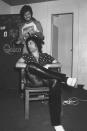 <p>Freddie Mercury gets his hair done backstage, before a concert, circa 1977.</p>