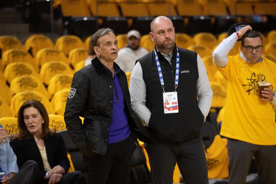 Sacramento Kings majority owner Vivek Ranadivé and General Manager Monte McNair stand courtside before Game 6 of the first-round NBA playoff series at Chase Center on Friday.