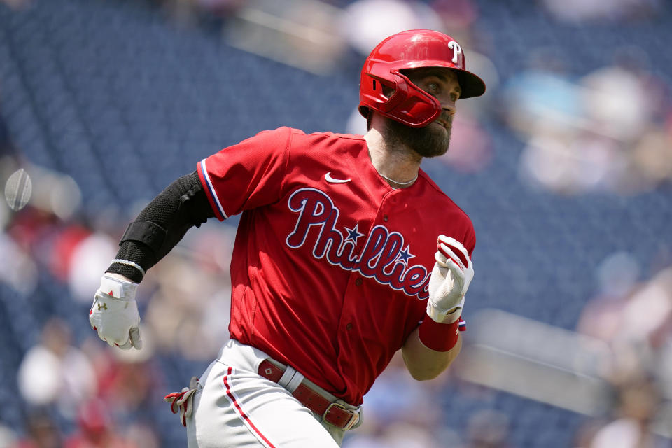 Philadelphia Phillies designated hitter Bryce Harper singles in the third inning of the first game of a baseball doubleheader against the Washington Nationals, Friday, June 17, 2022, in Washington. (AP Photo/Patrick Semansky)