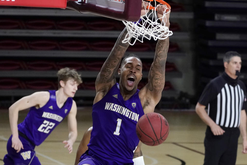 Washington forward Nate Roberts (1) dunks against Arizona State during the second half of an NCAA college basketball game, Thursday, Feb. 25, 2021, in Tempe, Ariz. (AP Photo/Rick Scuteri)