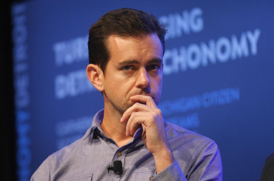 Jack Dorsey, chairman of Twitter and CEO of Square, listens to a fellow panelist during a Techonomy Detroit panel discussion held at Wayne State University in Detroit, Michigan September 17, 2013. REUTERS/Rebecca Cook (UNITED STATES - Tags: BUSINESS SCIENCE TECHNOLOGY)