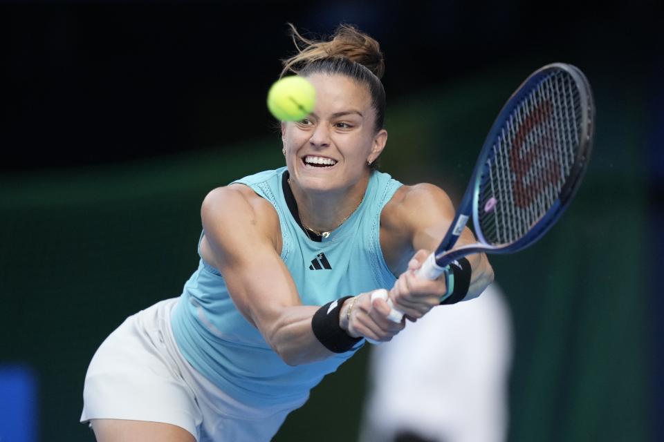 Maria Sakkari, of Greece ,returns a shot against Jessica Pegula, of the U.S., in their singles semifinal match at the Pan Pacific Open tennis tournament in Tokyo, Saturday, Sept. 30, 2023. French Open runner-up Karolina Muchova pulled out of the WTA Finals on Tuesday because of an injured right wrist and was replaced in the field for the season-ending tournament by Maria Sakkari. (AP Photo/Hiro Komae, File)