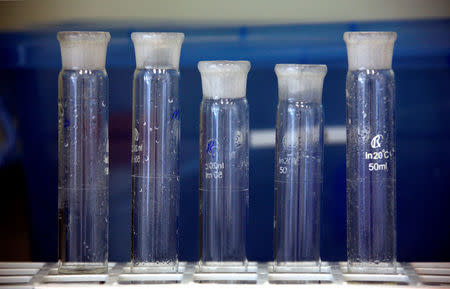 Containers are seen in a laboratory in an enzyme factory of Danish biopharmaceutical company Novozymes in Beijing, China May 24, 2011. REUTERS/David Gray/File Photo