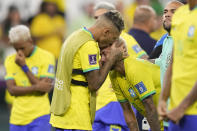 Brazil's Neymar is embraced by Brazil's Raphinha at the end of the World Cup quarterfinal soccer match between Croatia and Brazil, at the Education City Stadium in Al Rayyan, Qatar, Friday, Dec. 9, 2022. (AP Photo/Darko Bandic)