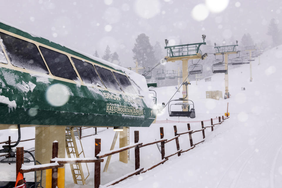 In this photo provided by Big Bear Mountain Resort, snow falls at the resort in Big Bear, Calif., Saturday, Feb. 25, 2023. (Lee Stockwell/Big Bear Mountain Resort via AP)