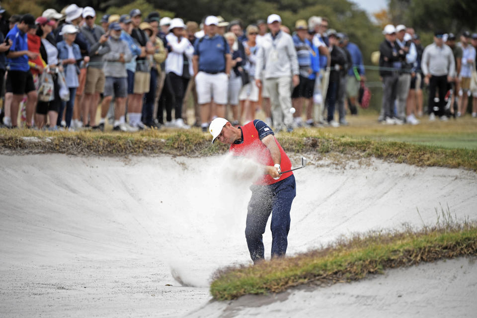 USA's Gary Woodland hits out of fairway bunker during a practice round ahead of the President's Cup golf tournament in Melbourne, Australia, Wednesday, Dec. 11, 2019. (AP Photo/Andy Brownbill)